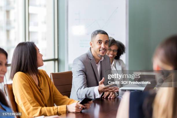 businessman facilitates meeting - persuasion stock pictures, royalty-free photos & images