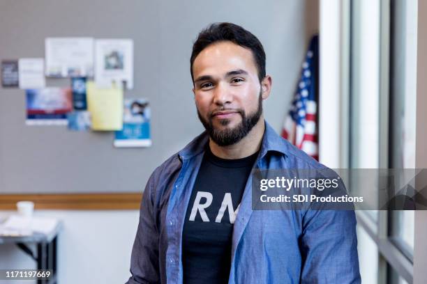 army vet poses for portrait in front of american flag - mental health services stock pictures, royalty-free photos & images