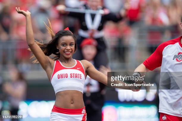An Ohio State Buckeyes cheerleader performs during game action between the Ohio State Buckeyes and the Miami Redhawks on September 21 at Ohio Stadium...