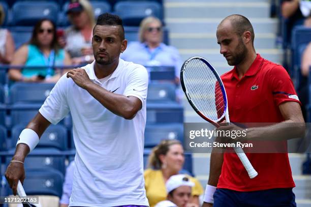 Nick Kyrgios of Australia and Marius Copil Romania speak during their Men's Doubles first round match on day five of the 2019 US Open at the USTA...