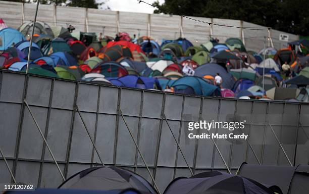 Festival goers tents are seen besides security fencing at the Glastonbury Festival site at Worthy Farm, Pilton on June 22, 2011 in Glastonbury,...
