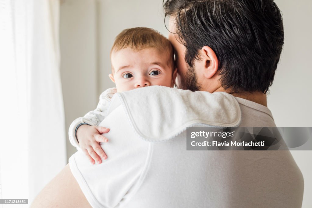 Father burping his baby