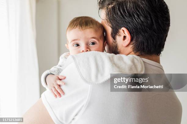 father burping his baby - father newborn stock pictures, royalty-free photos & images