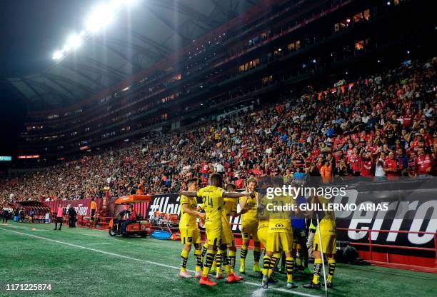 Morelia's players after scoring a goal during the Mexican Apertura tournament football match between Club Tijuana and Monarcas Morelia at Caliente...