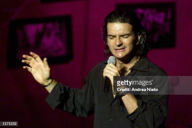 Guatemalan singer Ricardo Arjona sings a song from his new album titled "Galeria Caribe" October 19, 2001 in Guatemala City. One song named ''El...