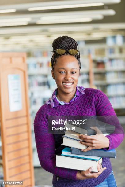 african-american high school student with stack of books - gulf coast states photos stock pictures, royalty-free photos & images