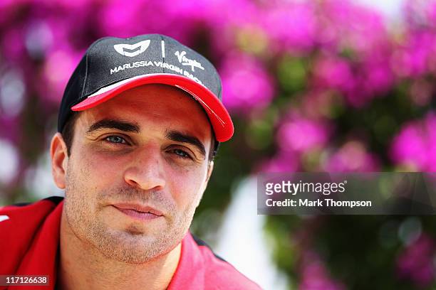 Jerome D'Ambrosio of Belgium and Marussia Virgin Racing is interviewed in the paddock during previews to the European Formula One Grand Prix at the...
