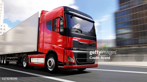 semi-truck with trailer driving on a city road - transportation truck stock pictures, royalty-free photos & images