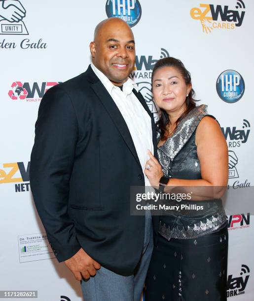 Fred Smith and guest attend the eZWay Awards Golden Gala at Center Club Orange County on August 30, 2019 in Costa Mesa, California.