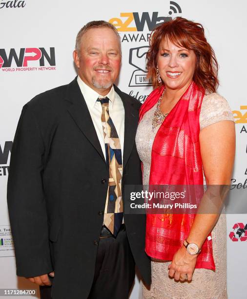 Holly Porter and guest attend the eZWay Awards Golden Gala at Center Club Orange County on August 30, 2019 in Costa Mesa, California.