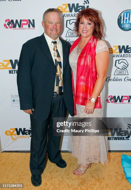 Holly Porter and guest attend the eZWay Awards Golden Gala at Center Club Orange County on August 30, 2019 in Costa Mesa, California.