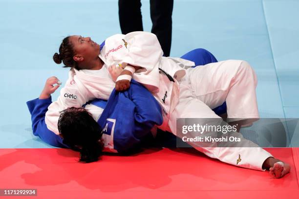 Beatriz Souza of Brazil throws Iryna Kindzerska of Azerbaijan to win by Ippon in the Women's +78kg Repechage on day seven of the World Judo...