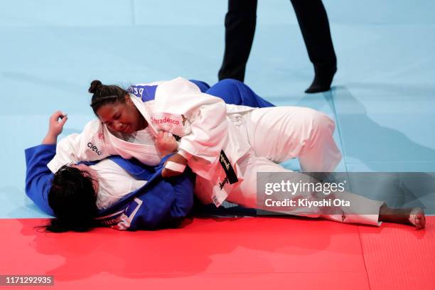 Beatriz Souza of Brazil throws Iryna Kindzerska of Azerbaijan to win by Ippon in the Women's +78kg Repechage on day seven of the World Judo...