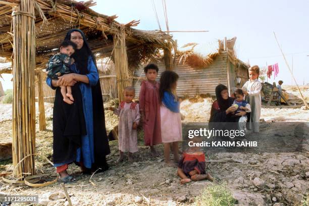 Photo d'illustration représentant une famille de pêcheurs chiites irakiens dans la région marécageuse du Sud de l'Irak Al-Ahwar , dont l'histoire...