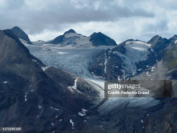 glacial landscape of griesgletscher and griessee from mt. nufenenstock in bedretto valley - glacier stock pictures, royalty-free photos & images