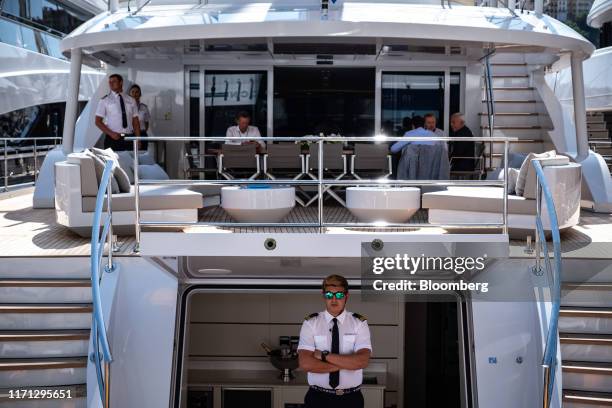 Crewmembers and guests stand aboard luxury sailing yacht All About U 2 superyacht, manufactured by Ada Yacht Works, during the Monaco Yacht Show in...