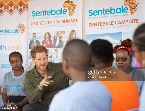 Prince Harry, Duke of Sussex joins in a confidence building exercise with young people during a visit to the Kasane Health Post, run by the Sentebale...