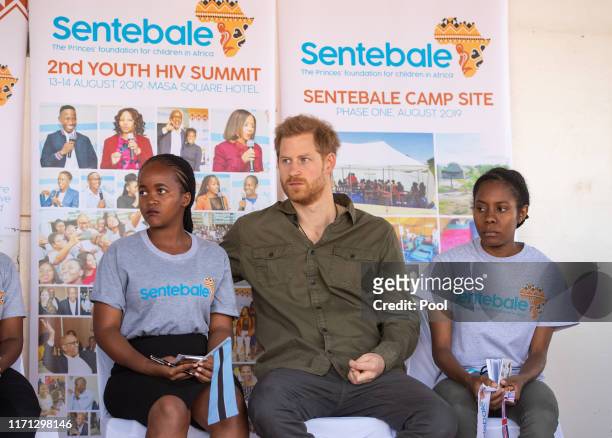 Prince Harry, Duke of Sussex joins in a confidence building exercise with young people during a visit to the Kasane Health Post, run by the Sentebale...