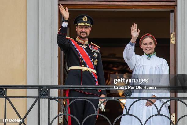 Crown Prince Haakon of Norway and daughter Princess Ingrid Alexandra of Norway wave to crowds as they attend her confirmation service n the Palace...