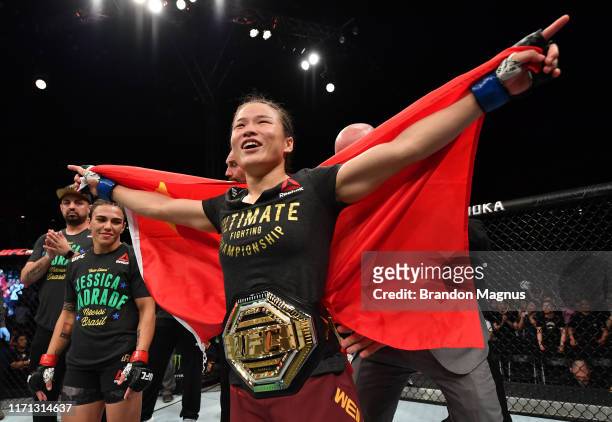 Zhang Weili of China celebrates after her knockout victory over Jessica Andrade of Brazil in their UFC strawweight championship bout during the UFC...