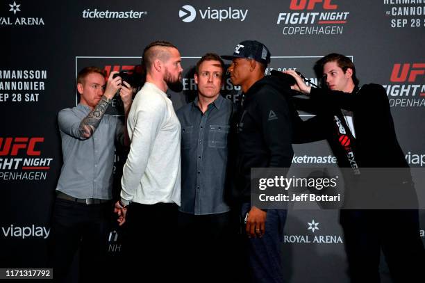 Nicolas Dalby and Alex Oliveira of Brazil face off during the UFC Fight Night Ultimate Media Day at the Radisson Blu Scandinavia Hotel on September...