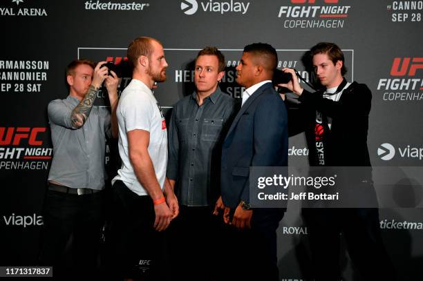 Gunnar Nelson of Iceland and Gilbert Burns of Brazil face off during the UFC Fight Night Ultimate Media Day at the Radisson Blu Scandinavia Hotel on...
