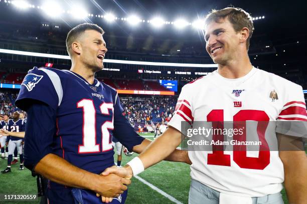 Tom Brady of the New England Patriots greets Eli Manning of the New York Giants after a preseason game at Gillette Stadium on August 29, 2019 in...