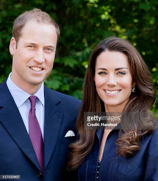 In this handout image supplied by St James's Palace, Prince William, Duke of Cambridge and Catherine, Duchess of Cambridge pose for the official tour...