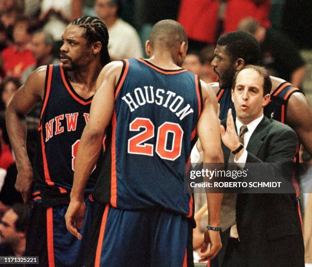 New York Knicks head coach Jeff Van Gundy talks to Latrell Sprewell , Allen Houston and Larry Johnson 16 May 1999 during game five of their first...