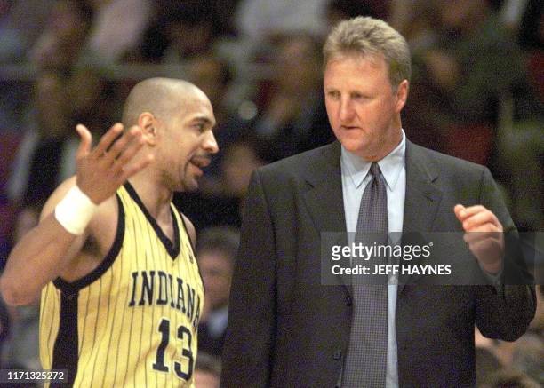 Indiana Pacers head coach Larry Bird has a word with Pacers player Mark Jackson during their game against the New York Knicks 11 June during the NBA...
