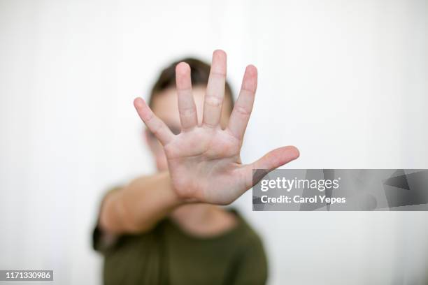 open palm.stop gesture - anti bullying symbols foto e immagini stock