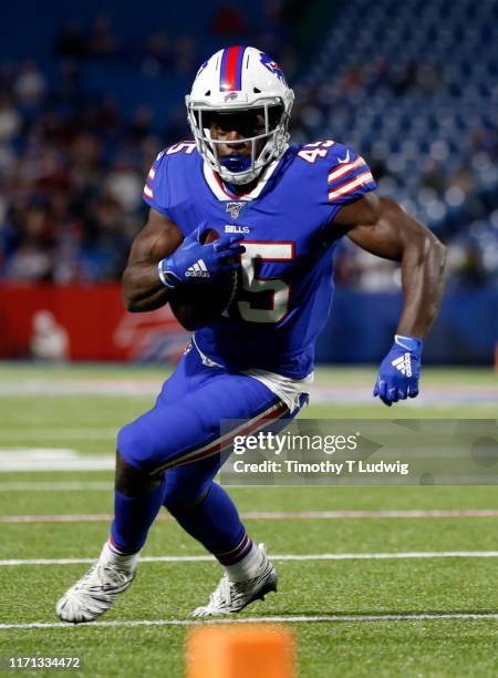 Christian Wade of the Buffalo Bills runs the ball during the second half of a preseason game against the Minnesota Vikings at New Era Field on August...