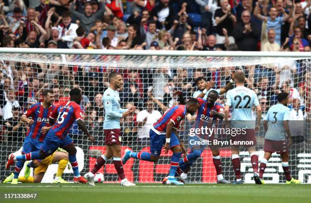 Jordan Ayew of Crystal Palace celebrates after scoring his team's first goal during the Premier League match between Crystal Palace and Aston Villa...