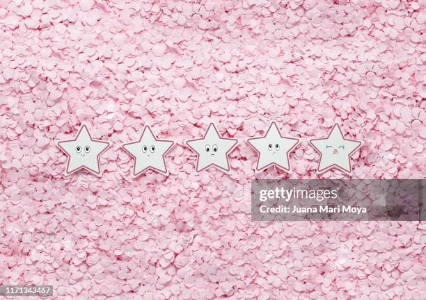 five stars with faces from greatest to least joy, on pink serpentine background - system failure stock pictures, royalty-free photos & images