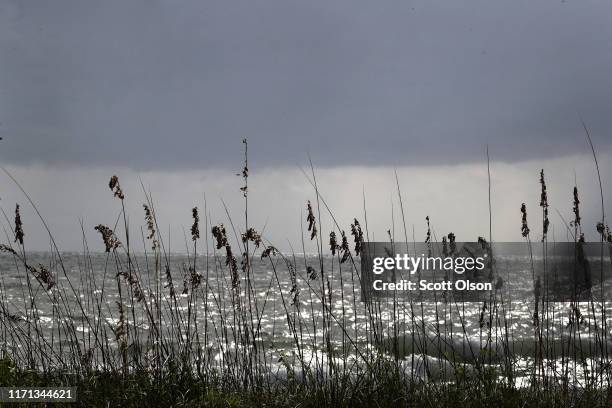 Rain clouds move toward shore as as Hurricane Dorian churns off the coast on August 31, 2019 near Fort Pierce, Florida. Dorian, once expected to make...