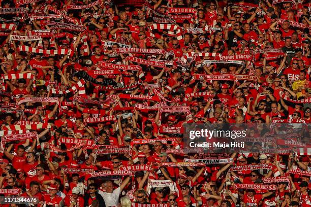 Union Berlin fans enjoy the atmosphere during the Bundesliga match between 1. FC Union Berlin and Borussia Dortmund at Stadion An der Alten...