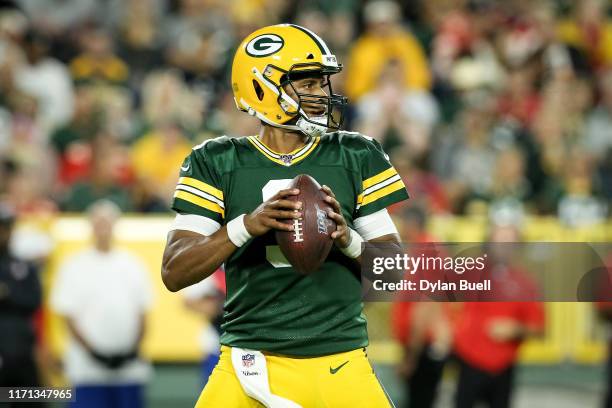 DeShone Kizer of the Green Bay Packers drops back to pass in the third quarter against the Kansas City Chiefs during a preseason game at Lambeau...