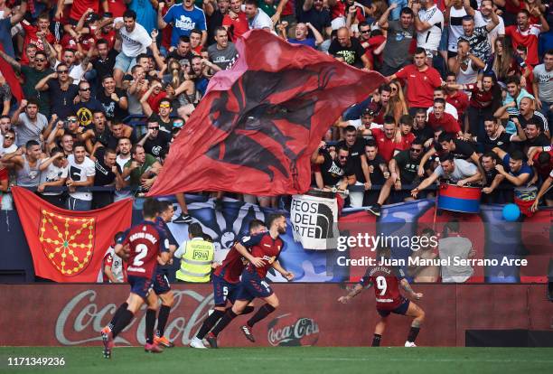 Roberto Torres of CA Osasuna celebrates with teammates after scoring his team's second goal during the Liga match between CA Osasuna and FC Barcelona...