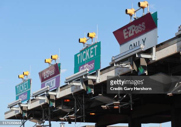 Pass lanes are marked at a toll plaza on the New Jersey Turnpike on August 29, 2019 in Newark, New Jersey.