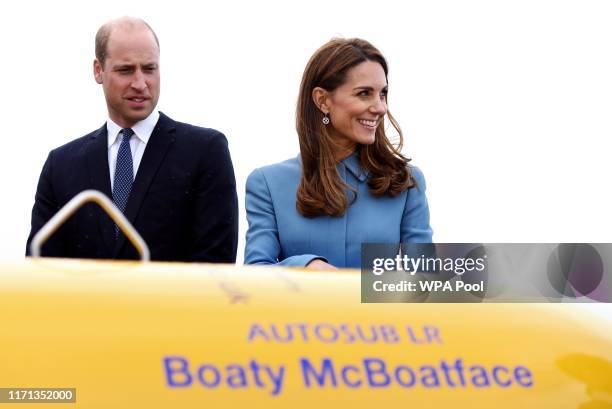 Prince William, Duke of Cambridge and Catherine, Duchess of Cambridge look on in front of the autosub, named 'Boaty McBoatface' following a public...