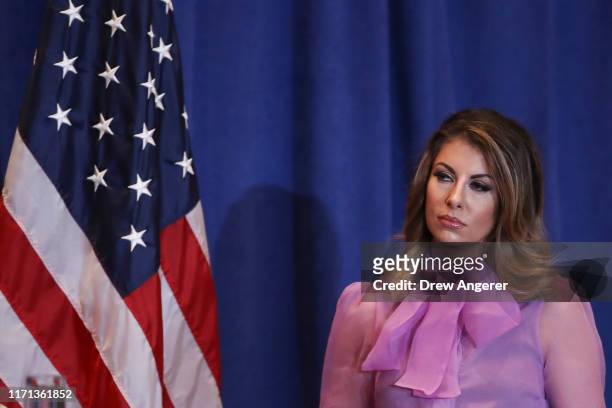 State Department spokeswoman Morgan Ortagus looks on as U.S. Secretary of State Mike Pompeo speaks during a press conference on the sidelines of the...