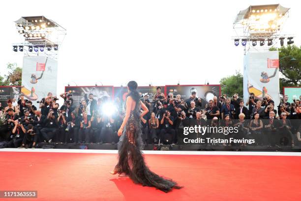 Hikari Mori walks the red carpet wearing a Jaeger-LeCoultre watch at the "The Joker" premiere during the 76th Venice Film Festival at Palazzo del...
