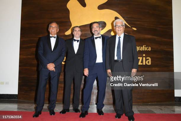 Drector of the festival Alberto Barbera, Joaquin Phoenix, director Todd Phillips and president of the festival Paolo Baratta walk the red carpet...