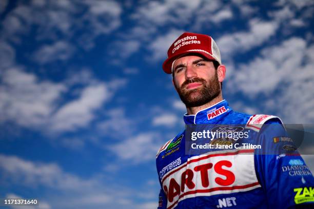 Corey LaJoie, driver of the CorvetteParts.net Ford, stands on the grid during qualifying for the Monster Energy NASCAR Cup Series Bojangles' Southern...