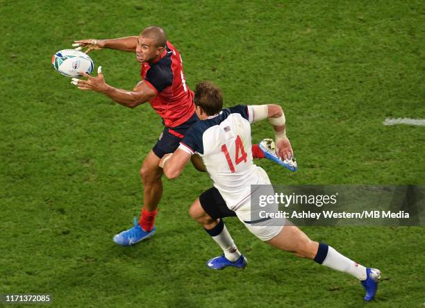 England's Jonathan Joseph is tackled by USA's Blaine Scully during the Rugby World Cup 2019 Group C game between England and USA at Kobe Misaki...