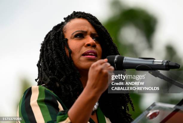 Representative Ayanna Pressley gestures as she speaks during the "People's Rally for Impeachment" on Capitol Hill in Washington, DC on September 26,...