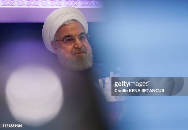 Iranian President Hassan Rouhani speaks during a press conference in New York on September 26, 2019. - Rouhani challenged countries who accused Iran...