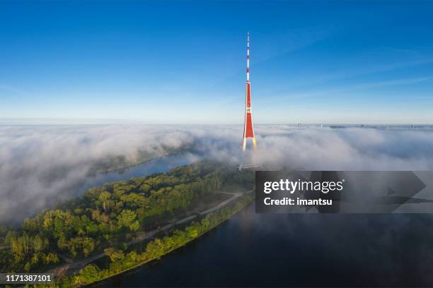 morning fog over riga - riga stock pictures, royalty-free photos & images