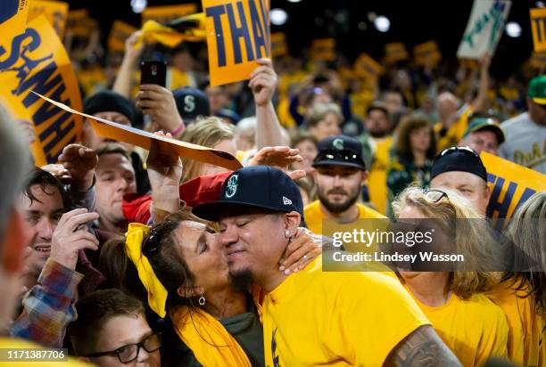 Fan Marianne Mingione kisses Felix Hernandez of the Seattle Mariners as he greets fans after his last game with the Mariners at T-Mobile Park on...