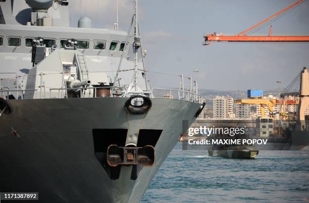 Russian ship is pictured at the Russian naval base in the Syrian Mediterranean port of Tartus on September 26, 2019. - With military backing from...